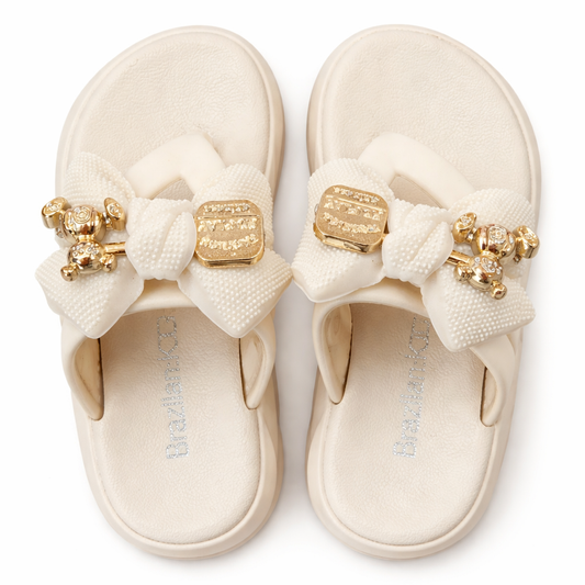 Girls Elegant Cream Bow Slides with Metallic Gold Bear